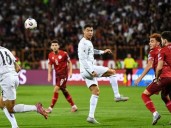 Poignant Portugal cruise, England unbeaten in World Cup qualifying