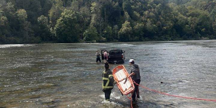 Driver rescued after crashing truck into river