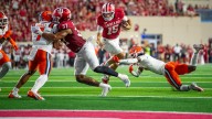 Game-used football from IU's win inserted into Fernando Mendoza Topps cards