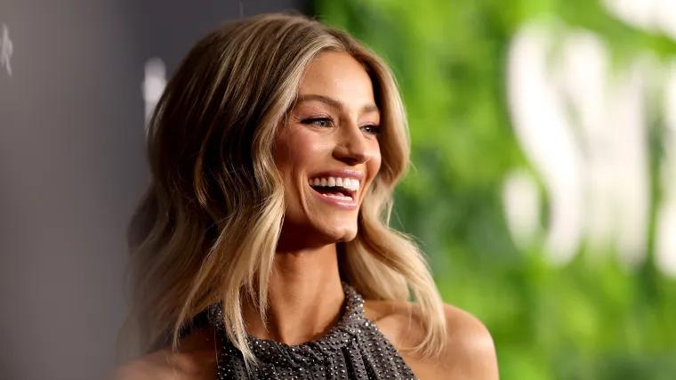 Ex-NFL cheerleader WAG hikes up skirt in braless appreciation post