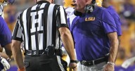 LSU football coach Brian Kelly gets trucked on sideline