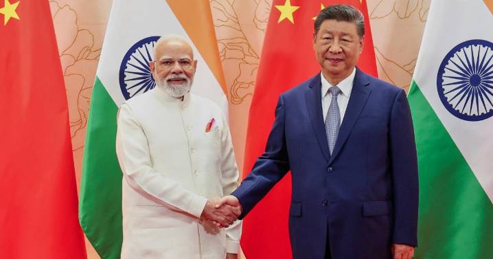 China's Xi and India's Modi at meeting vow to resolve long