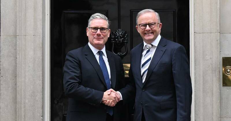 PM all smiles on subs pact after Downing Street chat