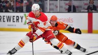 Flames re-sign ex-1st round forward to 3