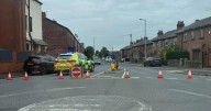 Main road shut off by police after cyclist injured