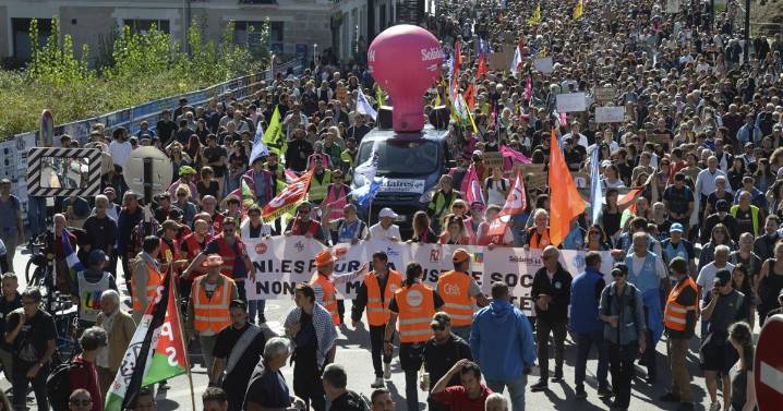 Strikes and protests roil France, pitting the streets against Macron and his new prime minister