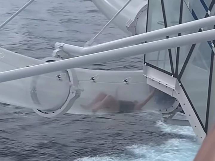 Woman's cruise ship waterslide ride ends awkwardly above the ocean