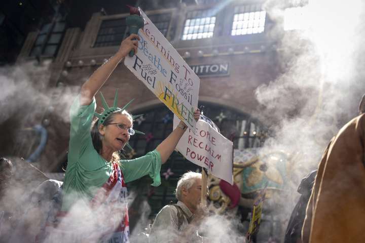 Marchers gather in worldwide protest of financial institutions “profiting off the climate crisis”