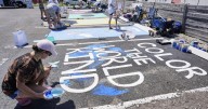 Parking spots used as colorful protest against Florida crackdown on rainbow crosswalks