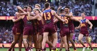 Snoop Dogg entertains at halftime as Brisbane successfully defends its Aussie rules football title