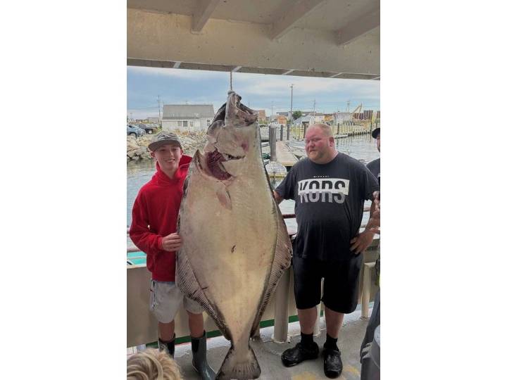 Teen catches huge halibut bigger than him
