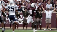 Reed leads Texas A&M past Utah State with 4 TDs