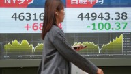 Asian shares are mixed as traders brace for a possible US government shutdown