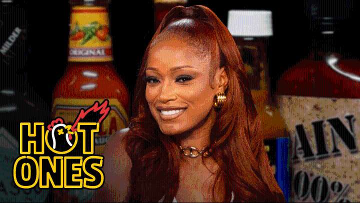 Keke Palmer Brings the Heat On A Spicy Bonus Episode of Hot Ones–Featuring A Surprise Sean Evans Smooch!