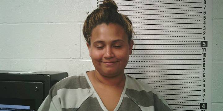Woman accused of threatening passing motorists with fake gun