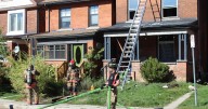 Man rescued from window of burning Hamilton home