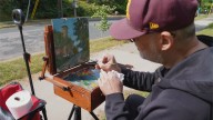 Artist Kickliy paints to benefit Annunciation shooting victims
