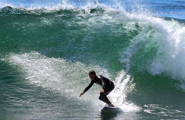 Photos | Labor Day swell brings crowds to Steamer Lane in Santa Cruz