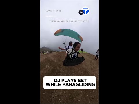 DJ performs live set while paragliding