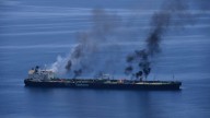 Vessel ablaze in Gulf of Aden off Yemen after being struck by a projectile, UK military says