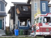 Dog dies, dozen residents displaced after Seton house fire