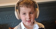 Tragic boy found dead at home pictured as woman charged with 'murder'