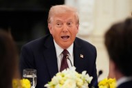 The Latest: DHS says 475 people were detained during an immigration raid in Georgia