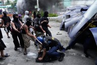Dozens arrested and hurt in clashes with police near Philippine presidential palace