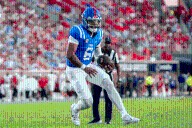 Trinidad Chambliss leads No. 17 Ole Miss to 41-35 win over Arkansas in inaugural start