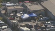 Body found in burned car at South LA tow yard