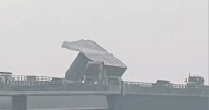 Modular home blown off trailer on Basnight Bridge