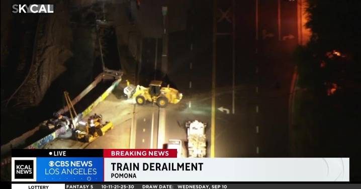 Abandoned Union Pacific rail cars derail from train tracks and into street