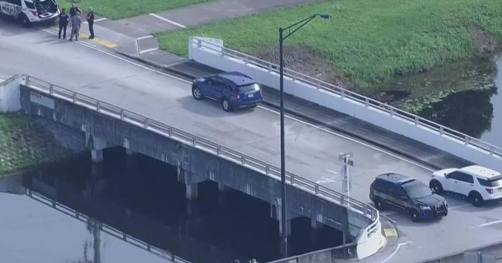 Man with wrist handcuffed wanted after jumping into Broward canal following traffic stop, FHP says