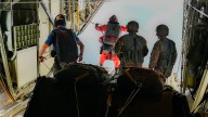 National Guardsmen pararescue team leap onto a freighter at sea to rescue patient