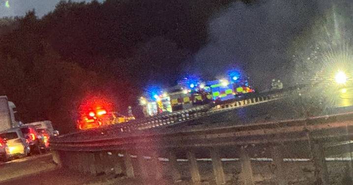 Traffic hell as major motorway closed while police and fire crews swarm scene