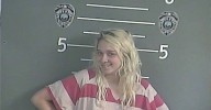 Mom poses for mug shot after leaving kids, ages 2 and 4, alone so she could 'go smoke': Cops