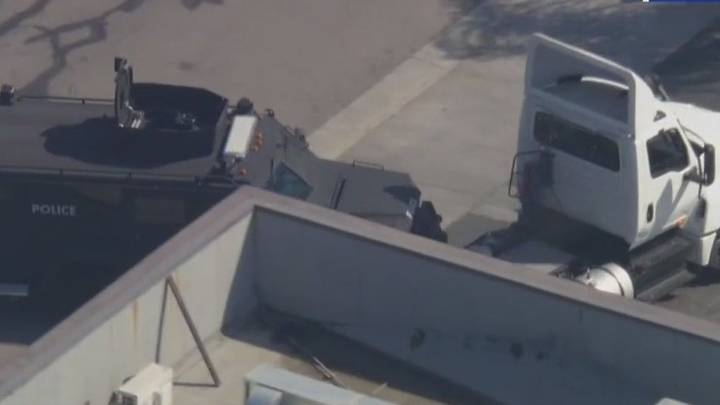 SWAT car clashes with stolen big rig mid