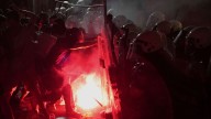 Tear gas fired at thousands of protesters in Serbia demanding free elections and justice