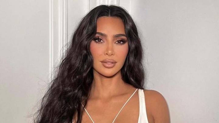 Kim Kardashian goes totally naked except for Cartier jewelry while laying in bed for French Vogue covershoot