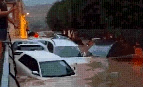 Spain hit by horror floods as deluge leaves drivers trapped and streets underwater… and red alert issued for MORE rain
