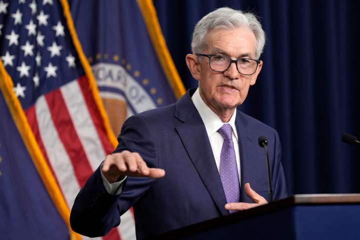 Federal Reserve cuts key rate by quarter-point and signals two more cuts this year