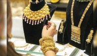 Gold reaches record high, poised for best month in 14 years