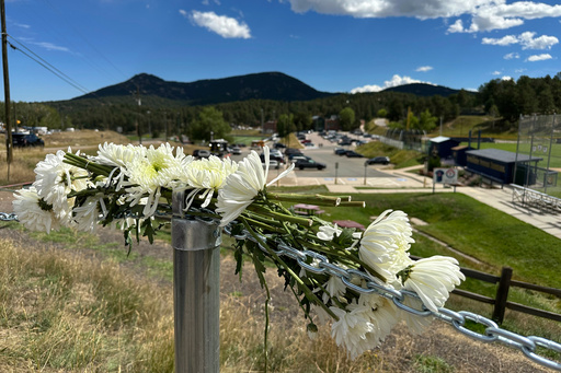 Authorities say student who had been radicalized fired revolver at Colorado school, wounding 2