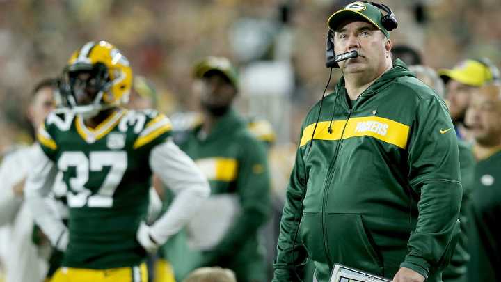 Mike McCarthy watching Badgers volleyball match with AD…