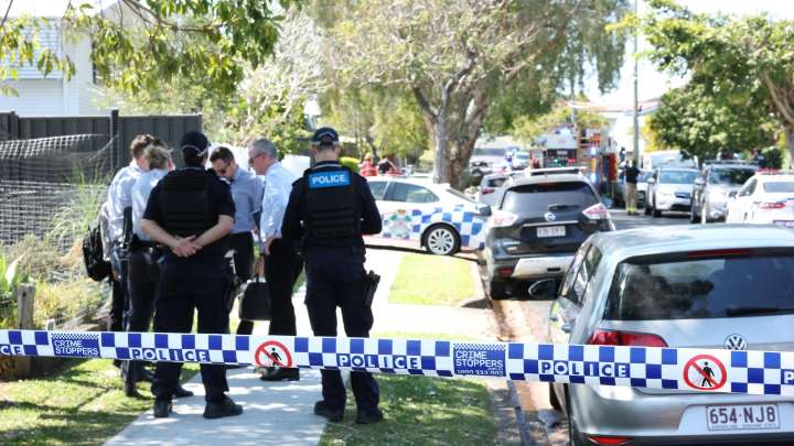 Police shoot man during a dramatic standoff at a burning home in Wynnum West, leaving him with life