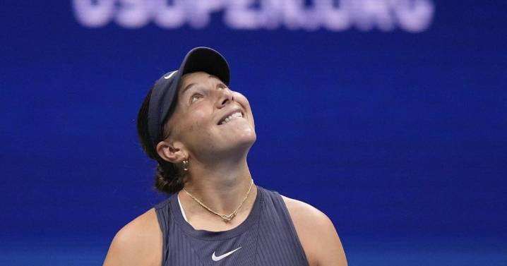 Anisimova struggles to serve with Arthur Ashe Stadium's roof closed during the US Open final