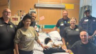 Girl rescued from car submerged in lake reunites with first responders