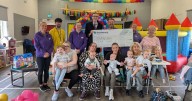 Housebuilder hands over bumper cheque to leading deaf