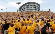 College football traditions: 'Hawkeye Wave' bonds everyone in stadium with kids in adjacent hospital
