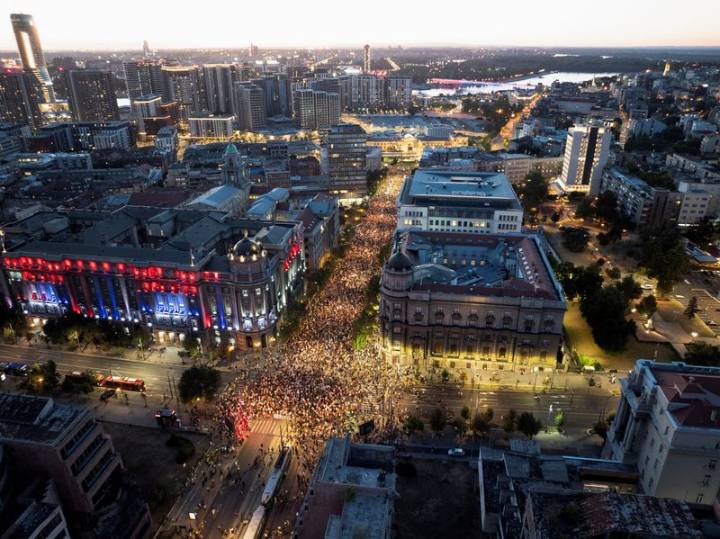Tens of thousands march in Serbia's capital, demand snap vote